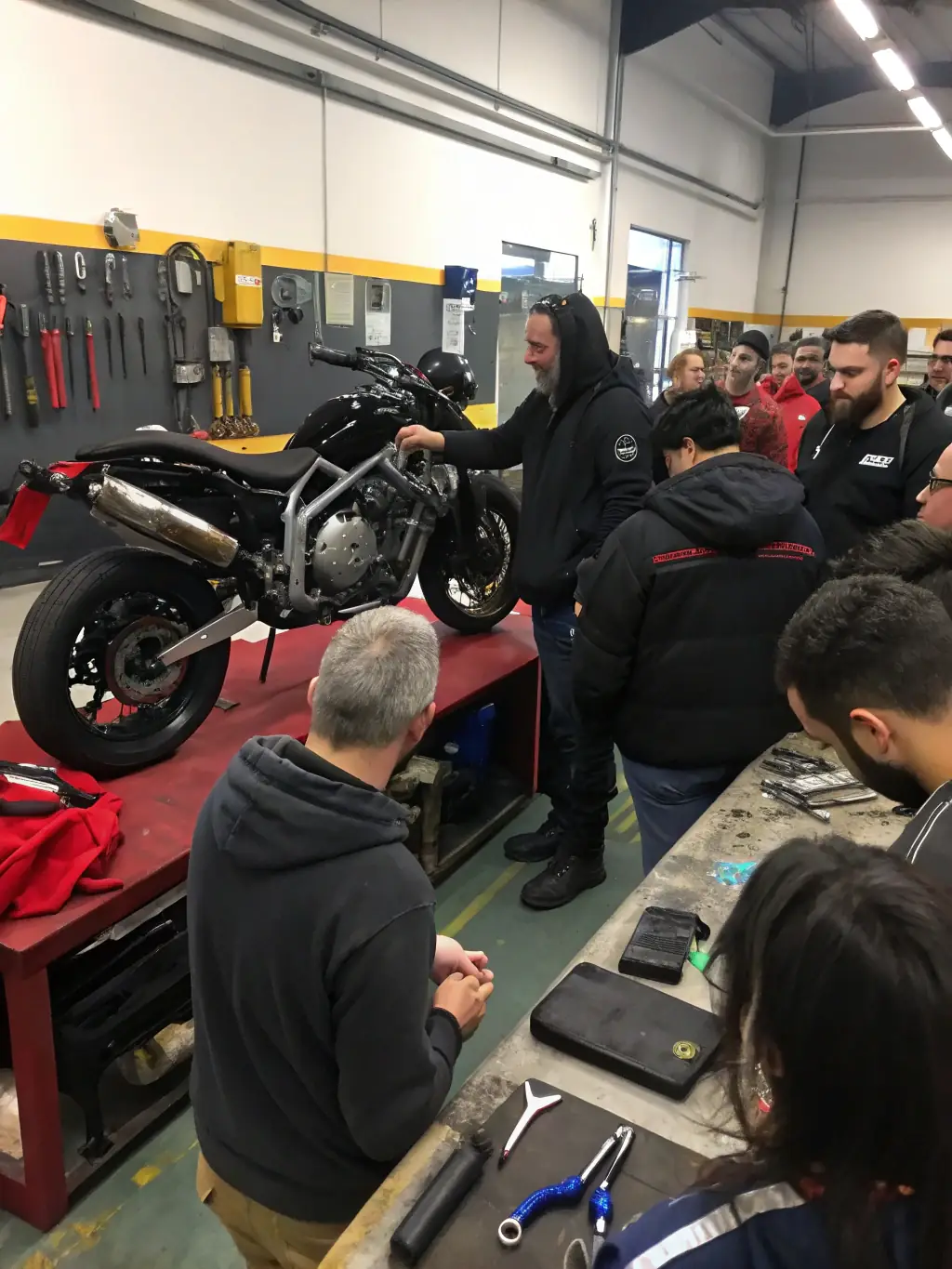 A photo of a safety workshop in progress, with instructors demonstrating proper riding techniques and participants actively engaging in the session.